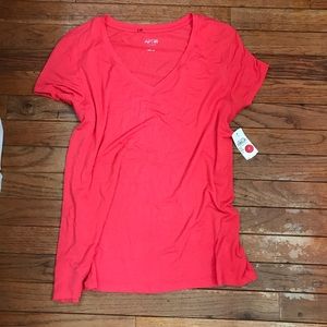 A orange-reddish short sleeve shirt